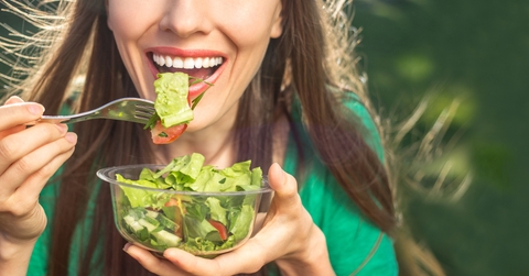 woman eating salad