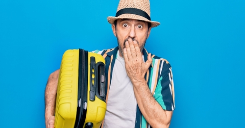 shocked man with luggage