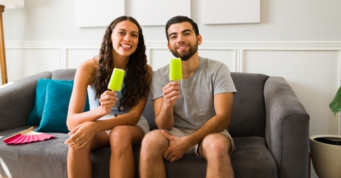 couple enjoying delicious popsicles