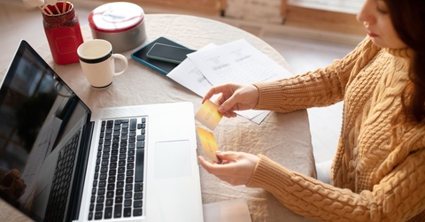 woman holding a credit card