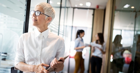 proud business woman standing in lobby