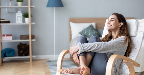 Woman relaxing in cozy chair