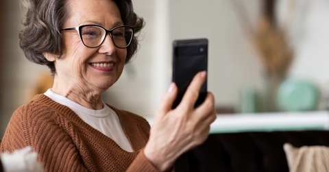 senior woman video calling using smartphone