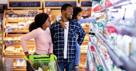 family with trolley shopping together