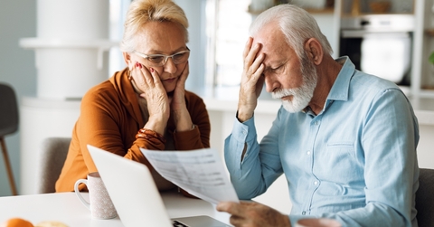 worried senior couple feeling stressed