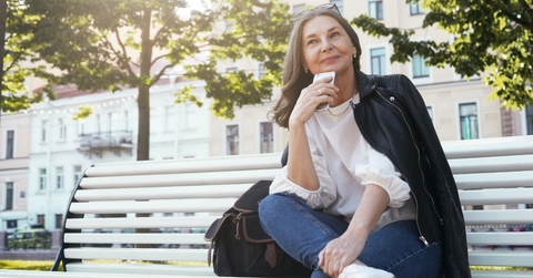 senior woman on bench outdoors