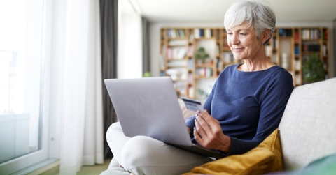 senior woman using credit card