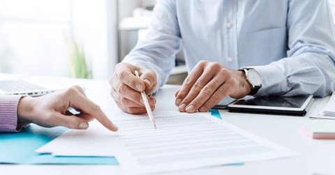 businessman discussing contract with female client
