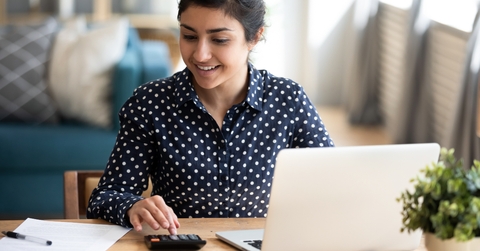 millennial indian woman paying bills