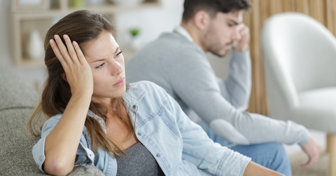 a couple is sitting separately