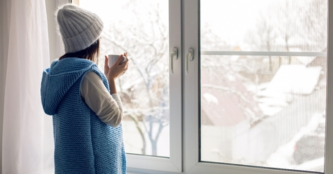 standing with a mug of tea