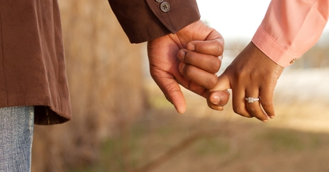african american couple holding hands