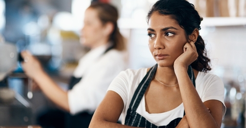 female waitress unhappy working at cafe