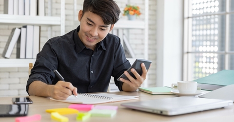 young man using the calculator