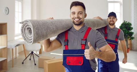movers carrying carpet