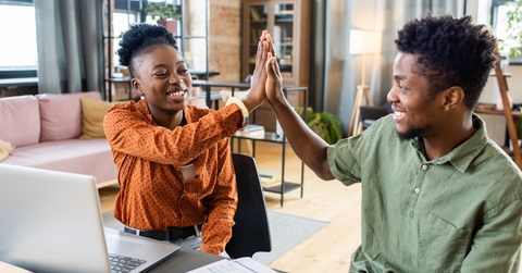 african american colleagues doing high five