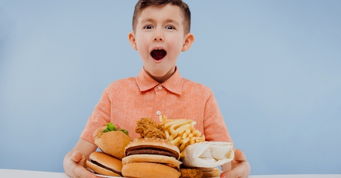 excited little boy with foods