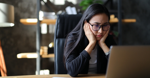 unhappy asian entrepreneur 