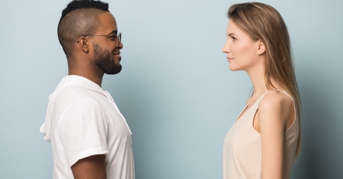 african man look at Caucasian woman