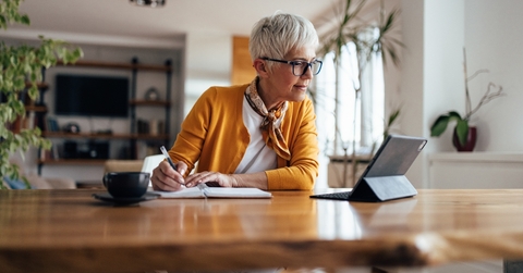 senior businesswoman writing