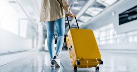 woman with luggage in airport