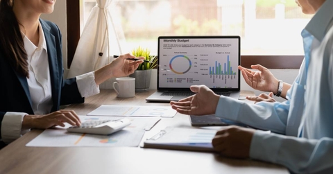 investment consultants analyzing financial reports