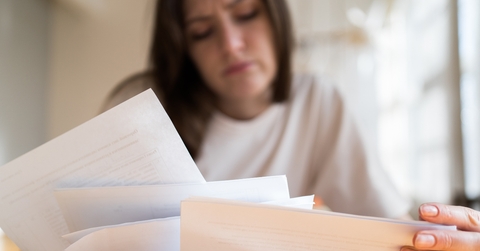 documents in the womans hands