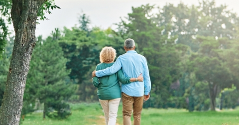 senior couple walking in outdoor park