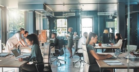  business people working in busy marketing office space