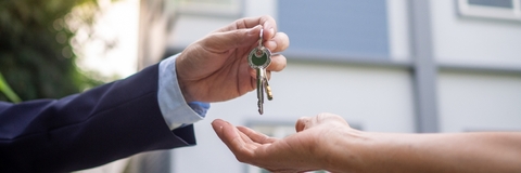 Home buyer taking keys from sellers
