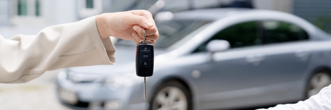giving car key to new owner