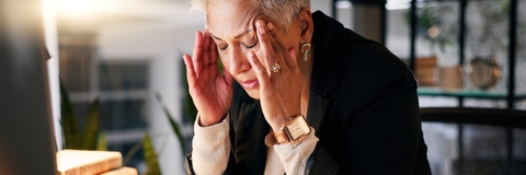 senior business woman having headache