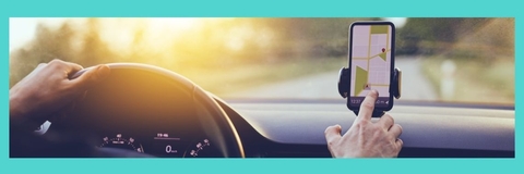 A driver uses a map on their phone