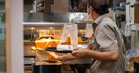 worker preparing takeaway food