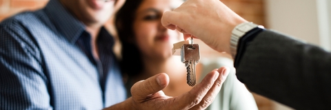 cheerful couple with keys