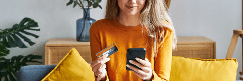 Happy woman shopping online with credit card