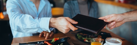 man paying bill with cash
