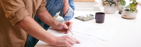 mature couple reviewing domestic finances