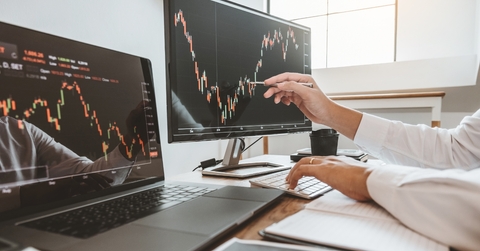 businessman analysing stock market graphs