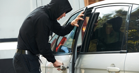 thief burglar at automobile car