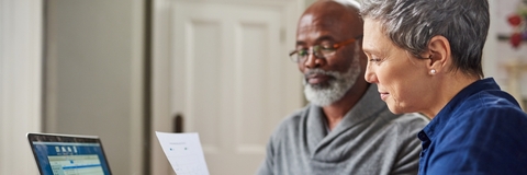 senior couple reviewing budget together