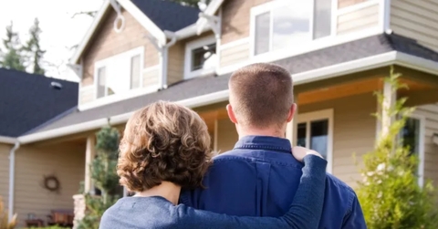 Couple outside of house