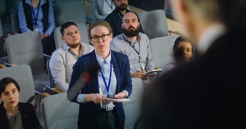 female journalist asking politician questions