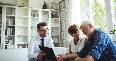 senior couple planning investments with financial advisor