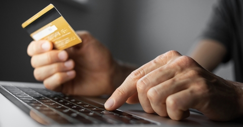 man hand holding credit card