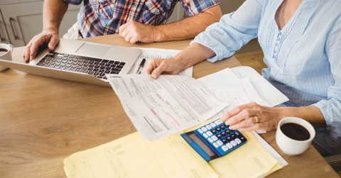 Senior couple reviewing bills together