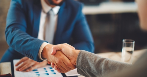 businessman shaking hand with client