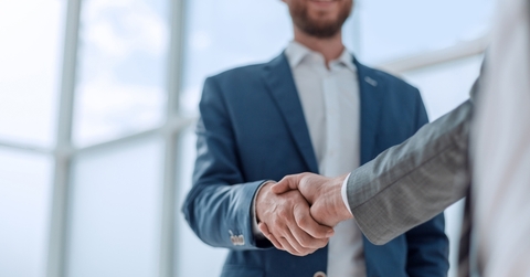 business partners shaking hands partnership concept