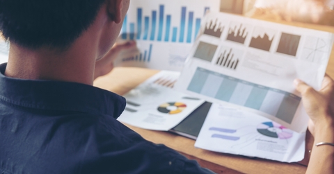 businessman reviews paper