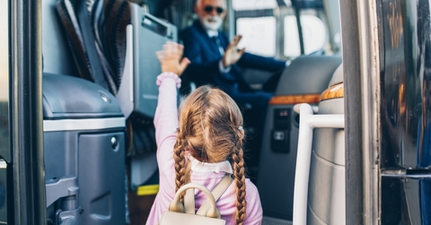 Little girl going into the bus